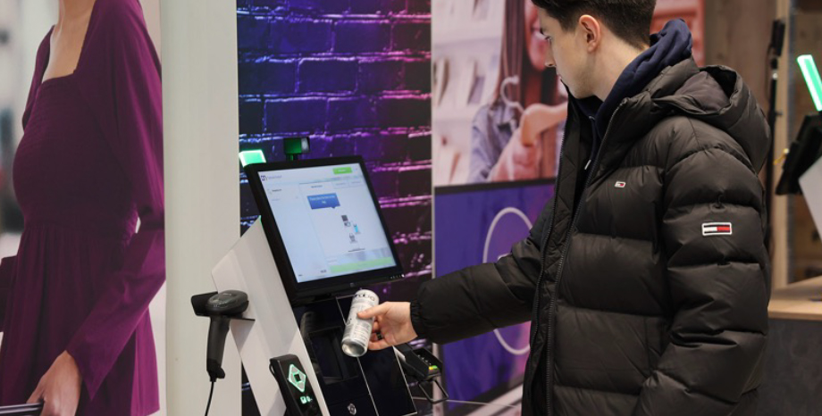 Customer using self-service kiosk